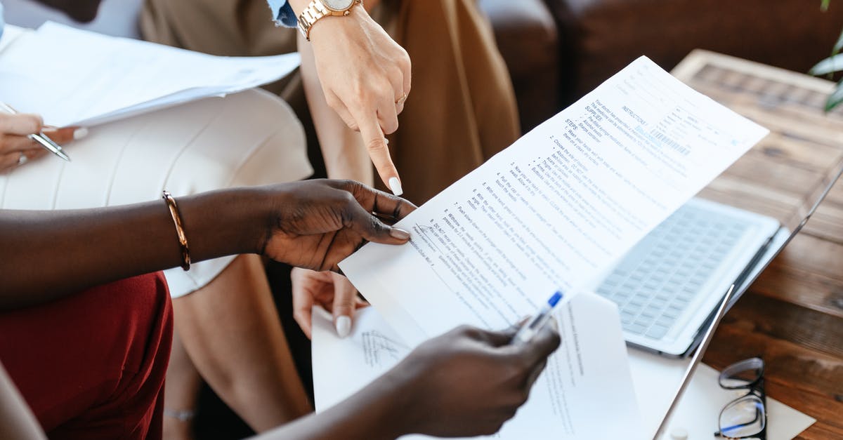 Is it important to knead biga/poolish? - Multiethnic businesswomen checking information in documents