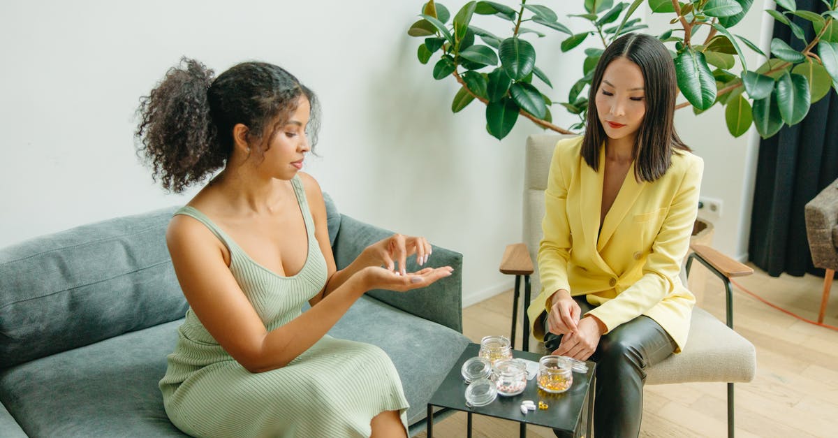 Is it normal for collard greens to be red? - Woman in Yellow Sleeveless Dress Sitting on Chair Beside Woman in Yellow Sleeveless Dress