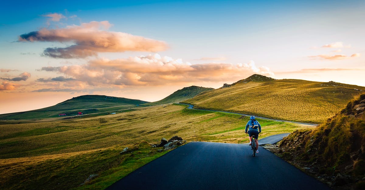 Is it OK to defrost chicken by running water over it? - Rear View of Man on Mountain Road Against Sky