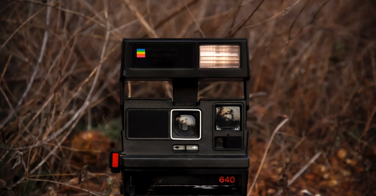 Is it possible to (safely) make dry instant rice? - Retro instant photo camera placed on stone on ground near leafless plants and bushes in daylight in countryside