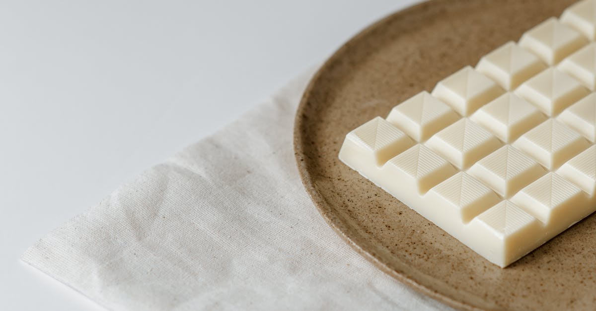 Is it possible to temper chocolate at home? - Delicious white chocolate on ceramic plate