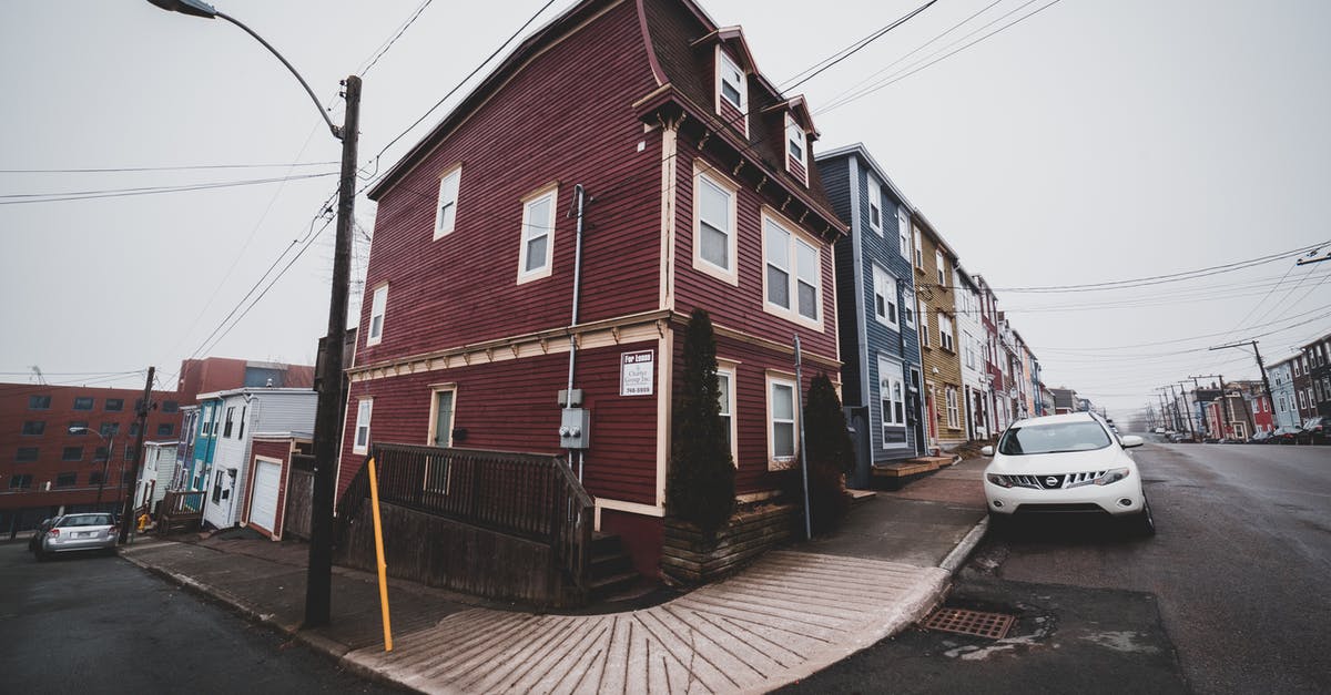 Is it possible to turn old tomatoes into flour? - Residential buildings near road with car