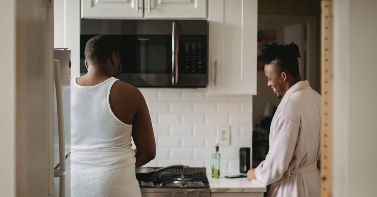 (Is it safe?) Preparing Breakfast in Bulk - Man in White Tank Top Standing Beside Woman in White Tank Top