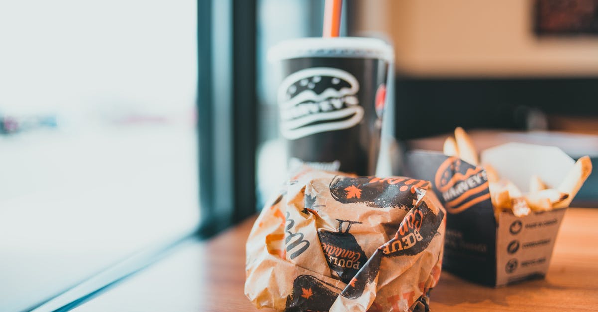 Is it safe to eat food that was heated in plastic wrap to the point the plastic wrap flamed? - Beverage and burger in cafe Is it safe to eat food that was heated in plastic wrap to the point the plastic wrap flamed? - Beverage and burger in cafe