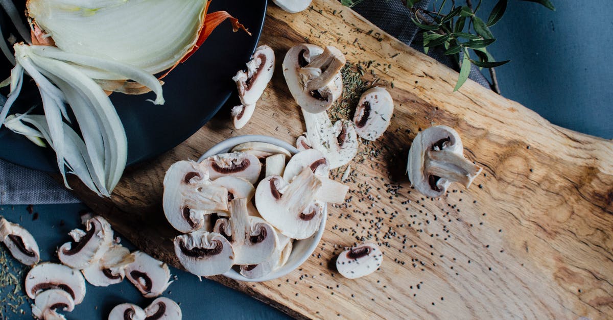 Is it safe to eat veggies that were chopped on bloody cutting board and then cooked? - Uncooked mushrooms and onion placed on table with fresh rosemary Is it safe to eat veggies that were chopped on bloody cutting board and then cooked? - Uncooked mushrooms and onion placed on table with fresh rosemary