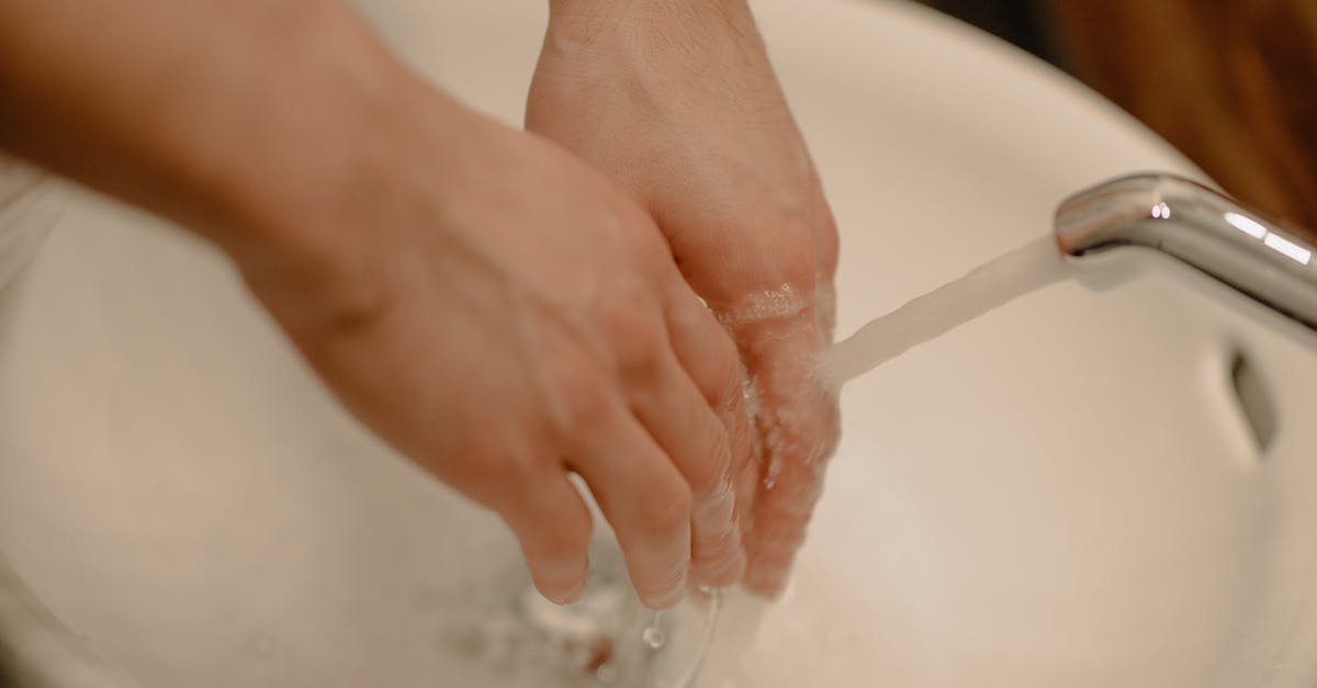 Is it safe to not wash mushrooms? - Person Washing Hands