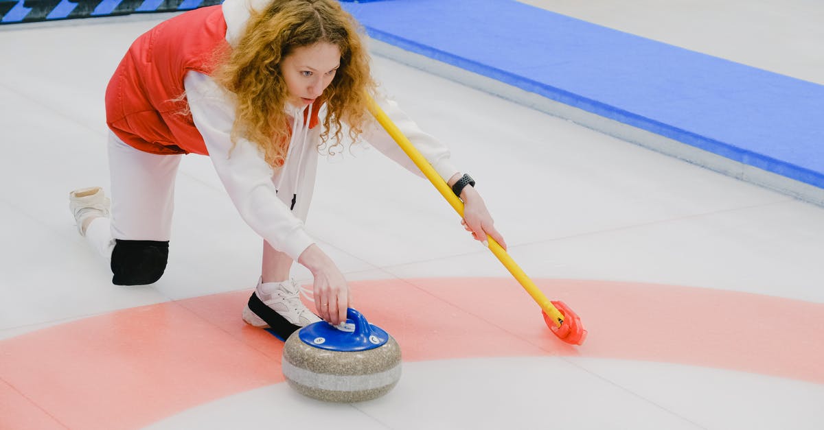 Is it safe to throw frozen meat in marinade? - Full body of active sportswoman in activewear with broom in hand throwing granite curling stone on ice sheet while playing game