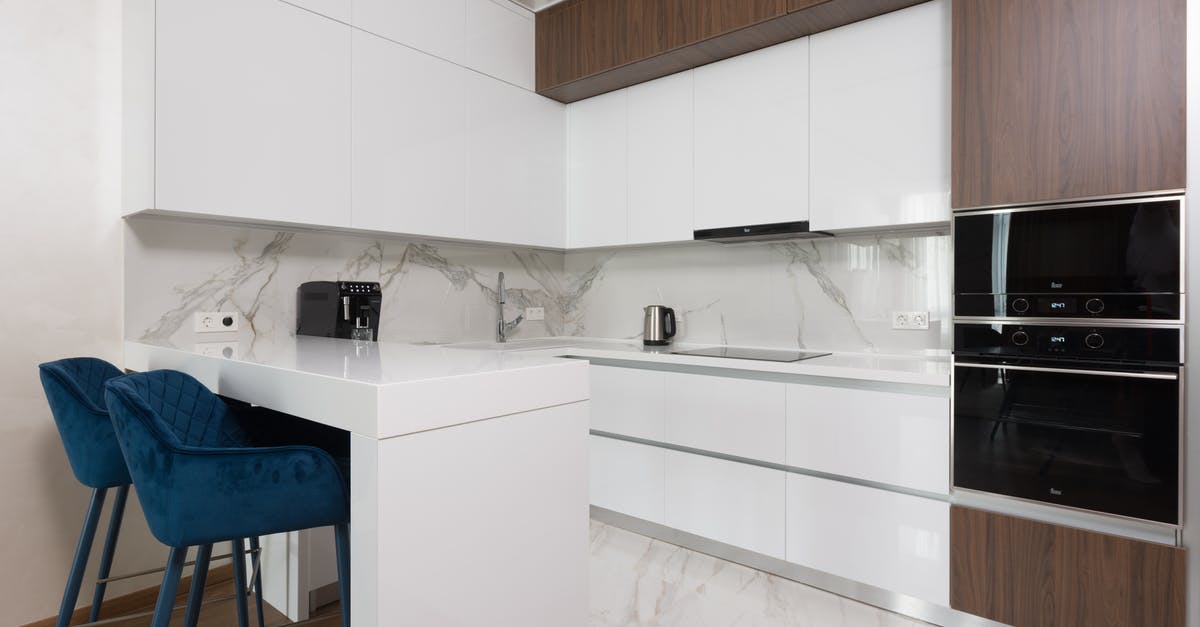 Is it safe to use a new microwave if I dropped it on the back corner? - Interior of light modern kitchen with chairs at dining table and appliances placed in modern apartment Is it safe to use a new microwave if I dropped it on the back corner? - Interior of light modern kitchen with chairs at dining table and appliances placed in modern apartment