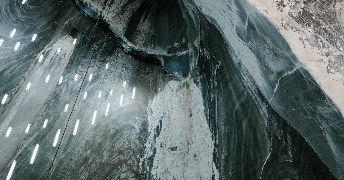 Is low sodium salt really effective? - From above of hanging LED lamps and salty stalactites on uneven walls of Salina Turda mine in Romania