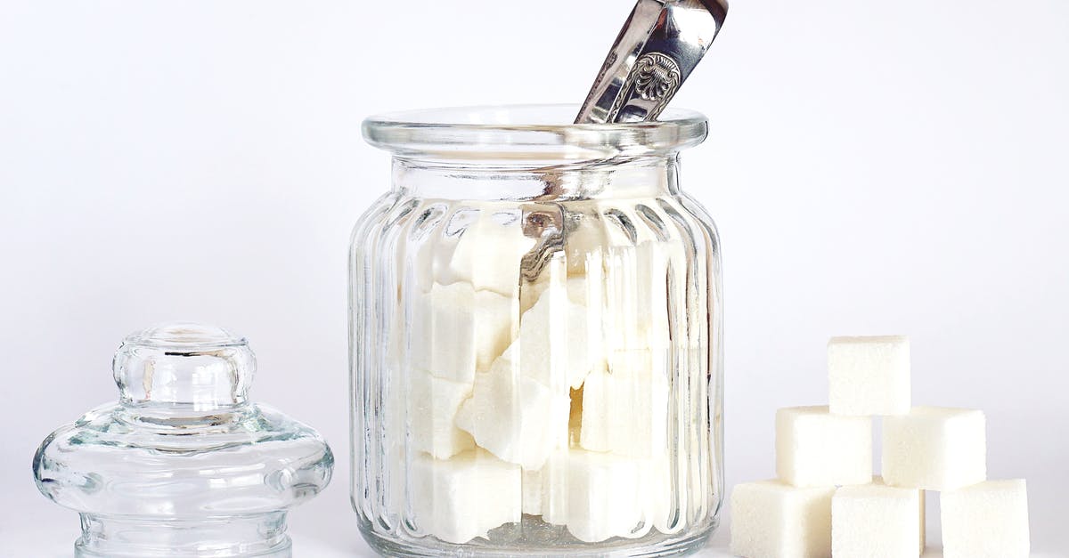 Is mustard lid supposed to pop when opening? - Close-Up Photo of Sugar Cubes in Glass Jar