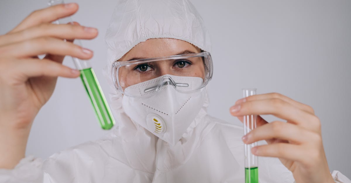 Is my biga supposed to be liquid? - A Person Wearing Personal Protective Equipment Holding Test Tubes