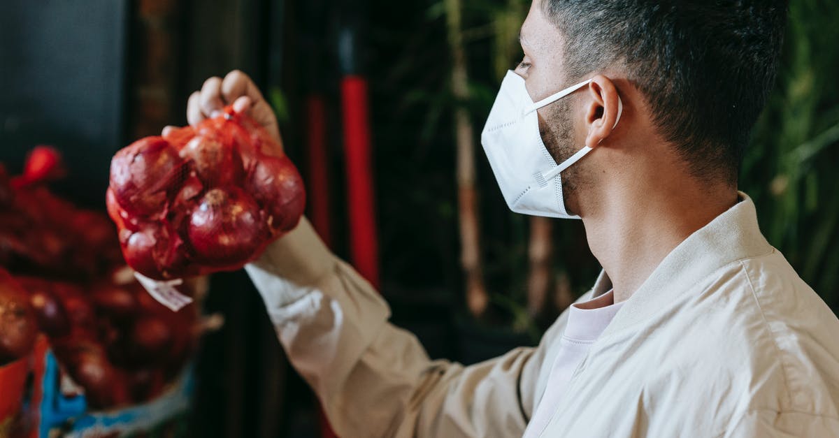 Is polyamide food safe? - Man in mask choosing grocery in store