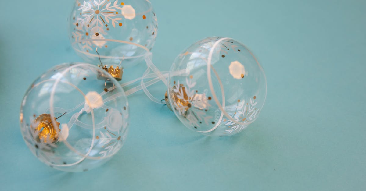 Is possible to create a transparent caramelization? - Glass Christmas baubles placed on blue background