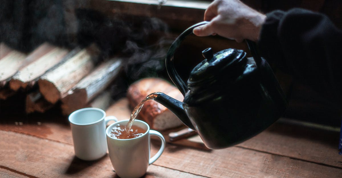 Is pouring hot stock into a blender safe? - Person Pouring Tea In White Ceramic Mug