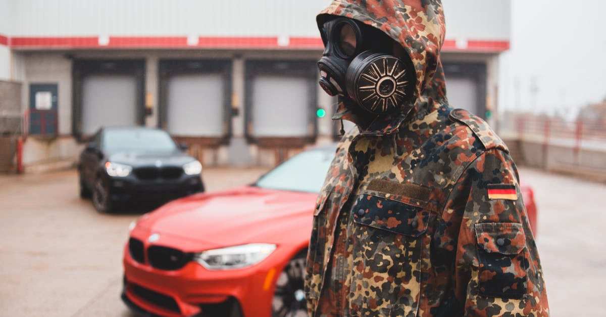 Is pyrex safe to use on a gas burner? - Unrecognizable man in protective respirator on street