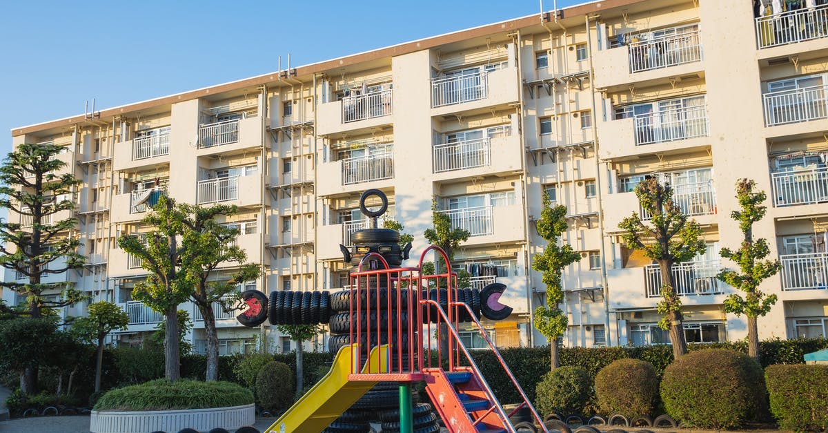 Is "krapfens" commonly used to designate donuts? - Playground in suburb yard with metal slide and huge robot made of pile of old rubber tyres