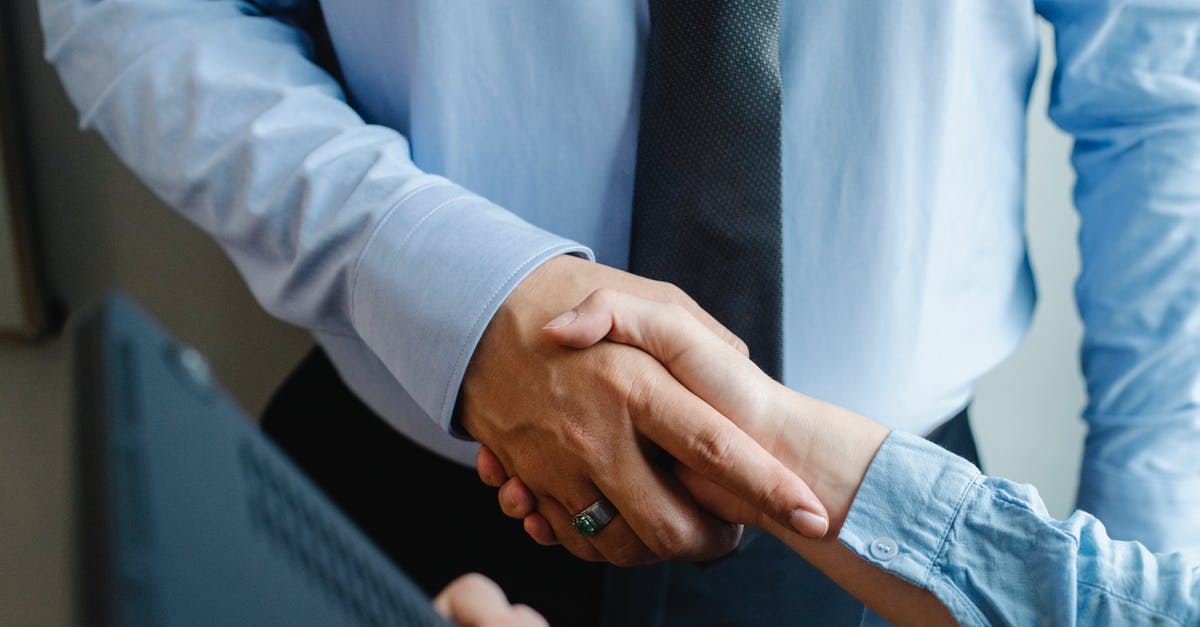 Is "mintiness" a well-defined thing? - High angle of crop unrecognizable male and female business partners in formal clothes shaking hands after successful deal