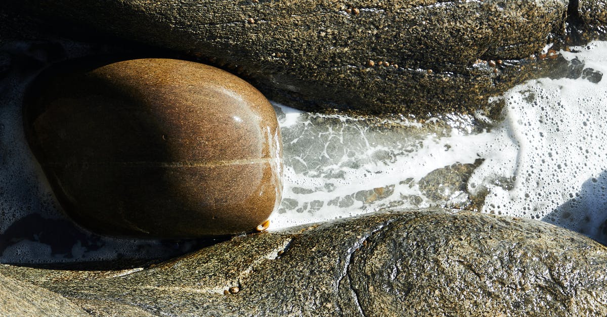 Is rapid cooling and thawing worth it? - Rough stones on foamy water of river