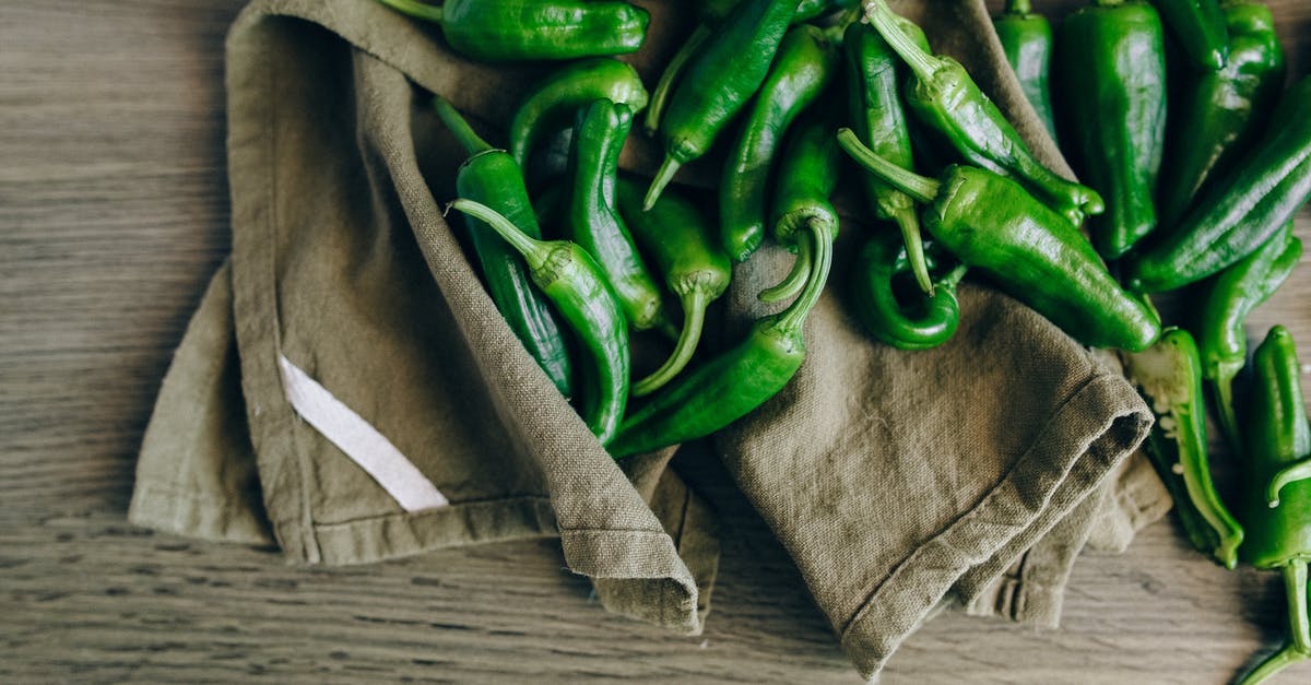 Is Serrano an acceptable substitute for jalapeno - Green Chilies on Wooden Table