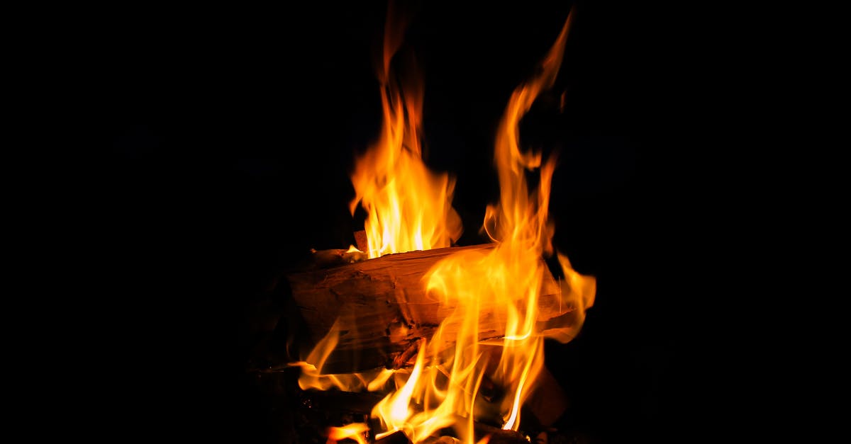 Is smoking with 'barked' wood dangerous? - Close-up of Bonfire at Night