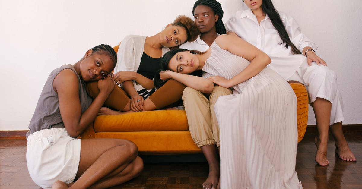 Is there a difference in appearance between semi and unsweetened chocolate? - Photo of Women Sitting on Orange Sofa