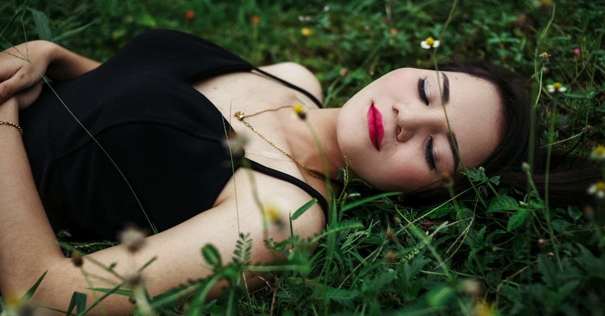 Is there a difference in the taste/seeds of egg-sized eggplants, and long and slim eggplants? - Stylish woman with bright makeup resting on lawn