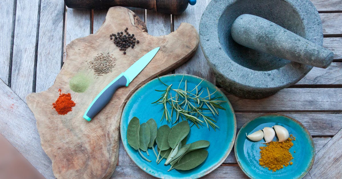 is there a downside to using a wood mortar and pestle? - Spices on Plate With Knife