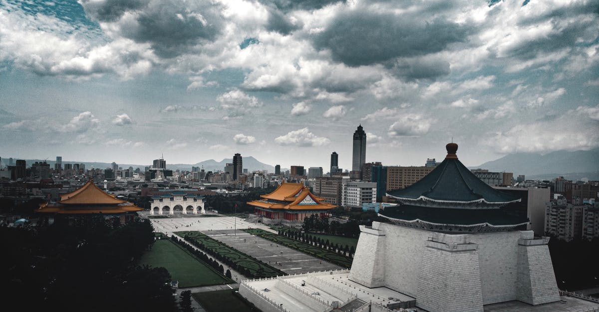 Is there a low tyramine substitute for tamari? - Historic stone temple with stairs surrounded by green lawn and contemporary multistage houses under sky with low clouds in overcast weather in evening in city