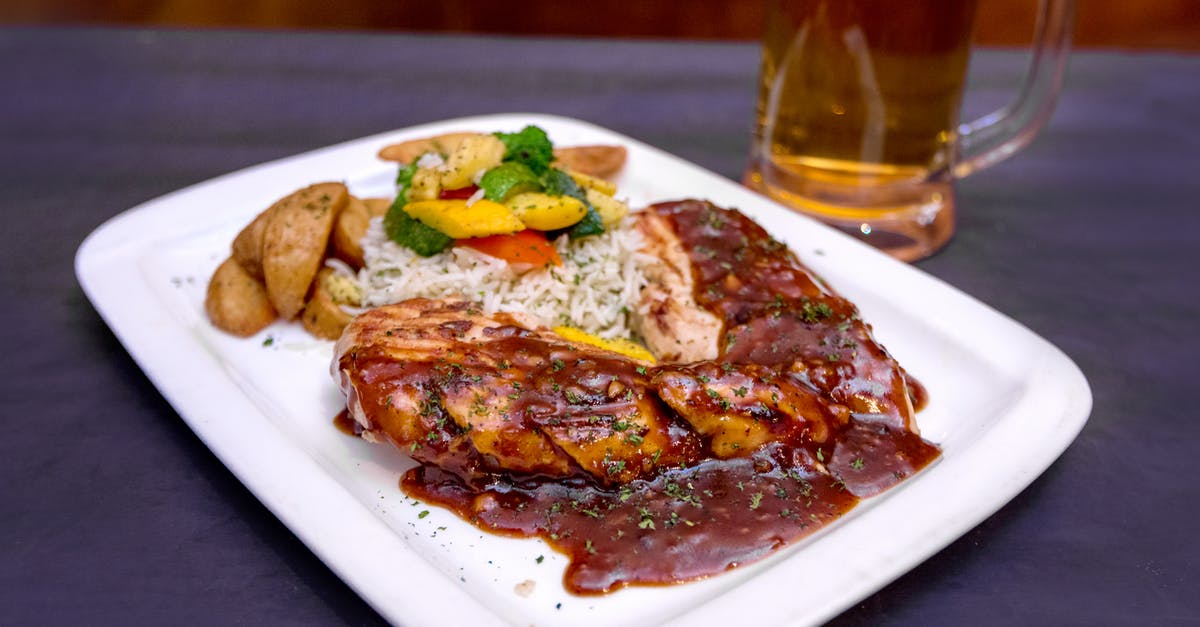 Is there a non-alcoholic substitute for rice wine? - From above of tasty grilled pork steak with barbecue sauce served with salad and fried potato on table near mug of beer