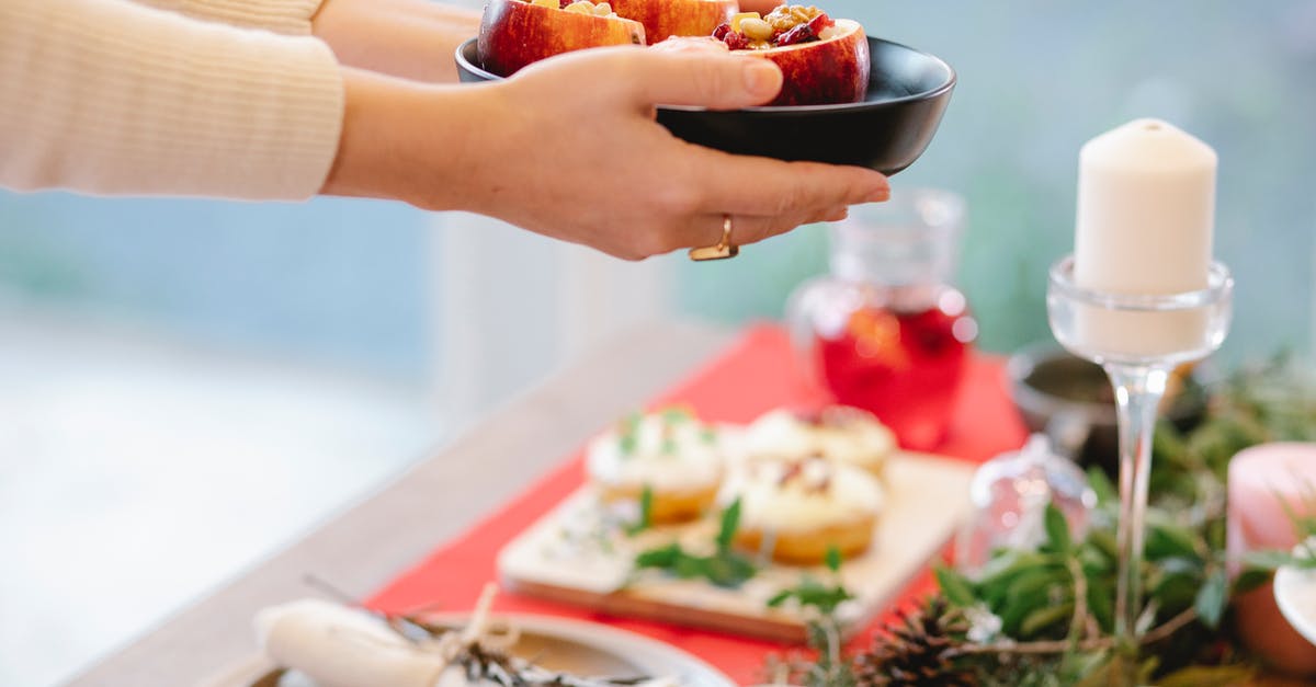 Is there a point in stuffing a chicken if I'm not planning on eating the stuffing part? - Crop chef with appetizing filled baked apples on Christmas day