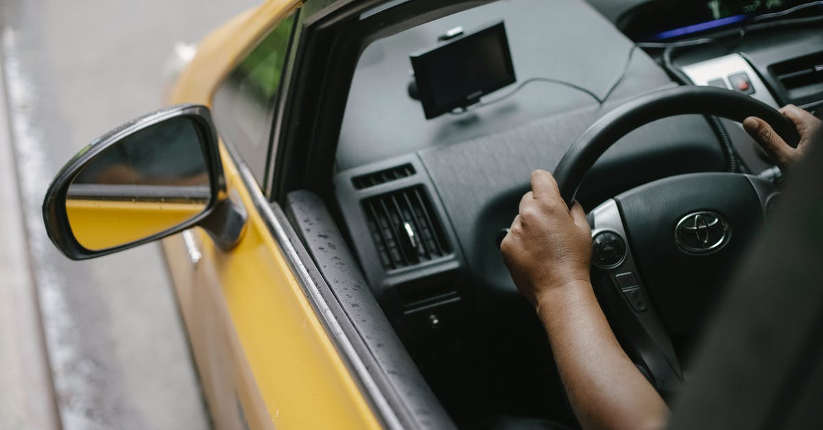 Is there a way to handmake alphabet pasta? - Faceless person driving contemporary cab in city