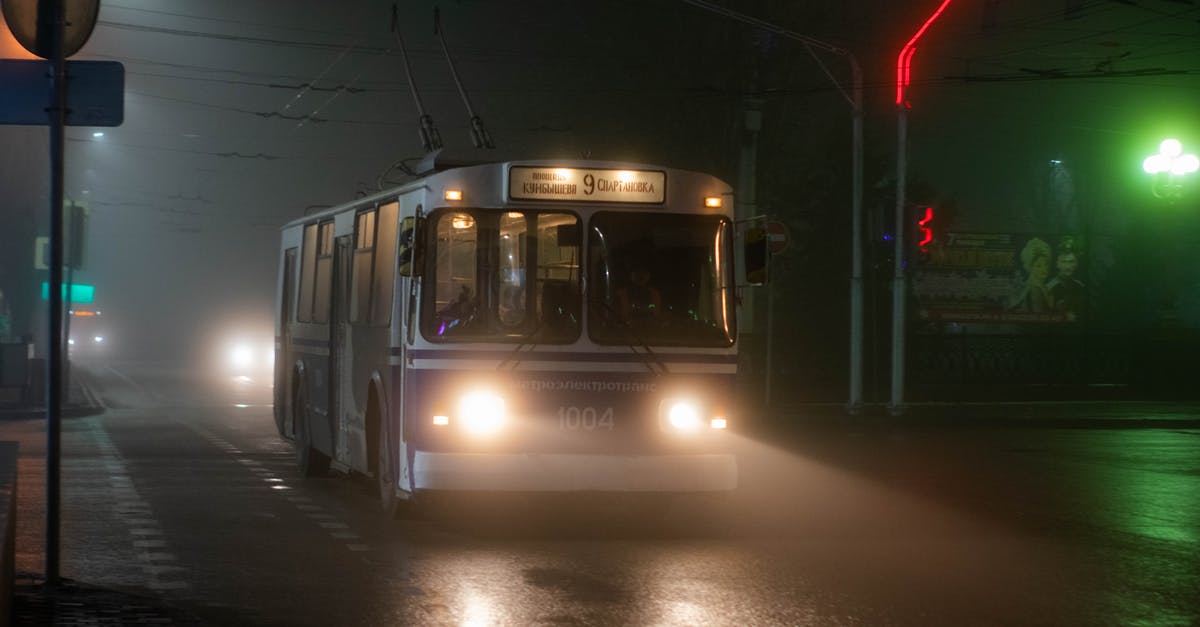 Is there a way to revive an old potato? - Old trolleybus driving along wet asphalt road in small city at foggy night