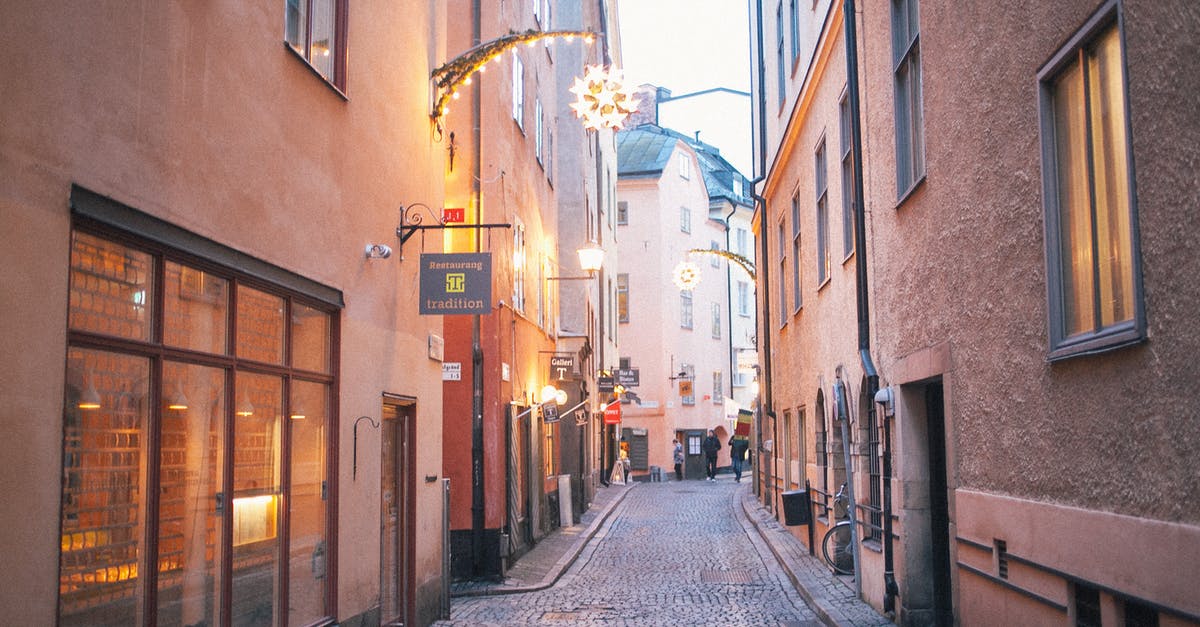 Is there a way to revive an old potato? - Narrow pedestrian street between old residential buildings at twilight