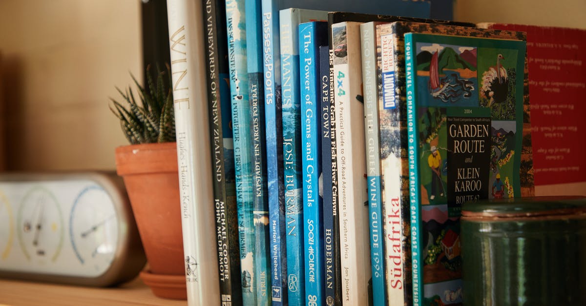 Is there an English word for the Spanish pepper called Ñora? - Wooden shelf filled with different interesting books near pots with green plants at home
