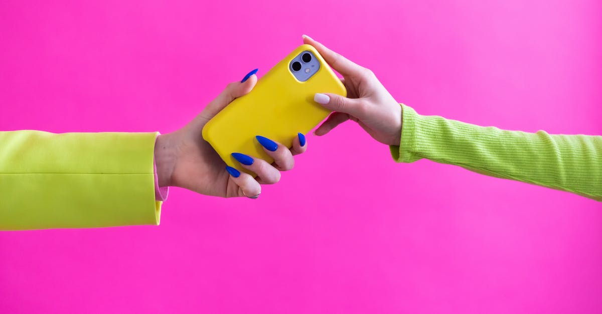 Is there another name for unrendered lard? - Unrecognizable Woman Handing Over Mobile Phone to Another Woman