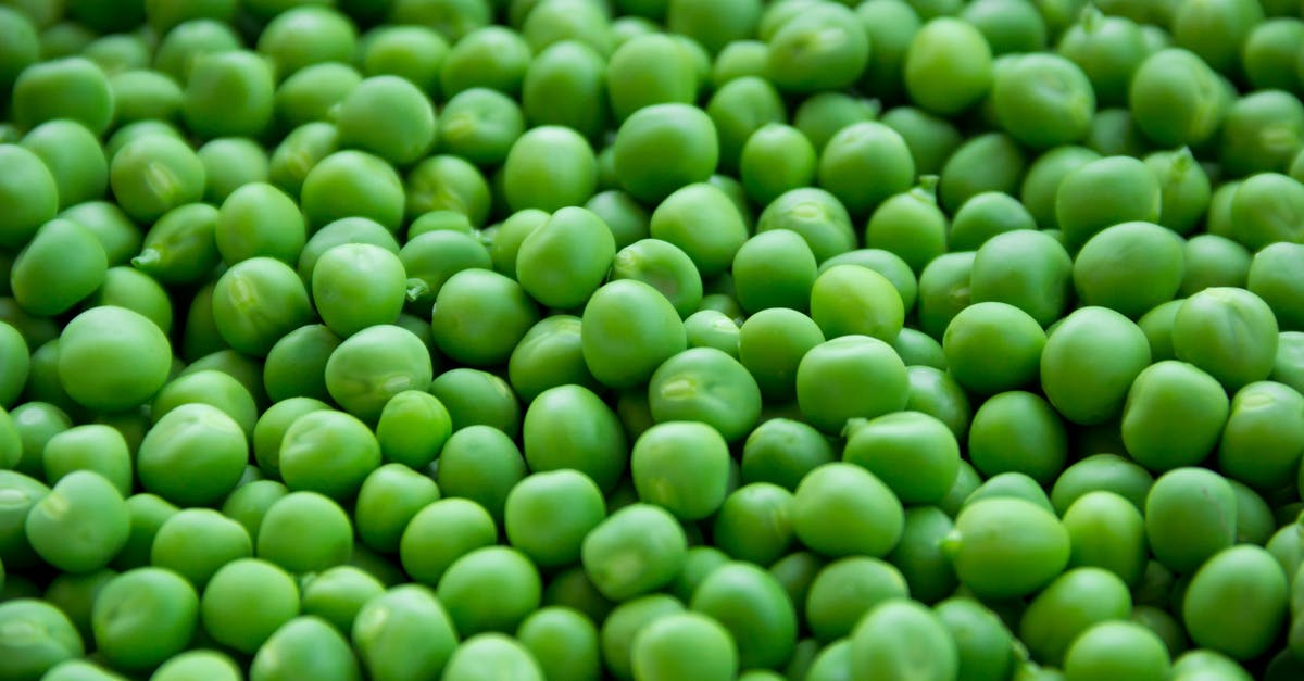 Is there any advantage to cooking beans in a pressure cooker, besides saving time? - Full Frame Shot of Green Peas Is there any advantage to cooking beans in a pressure cooker, besides saving time? - Full Frame Shot of Green Peas