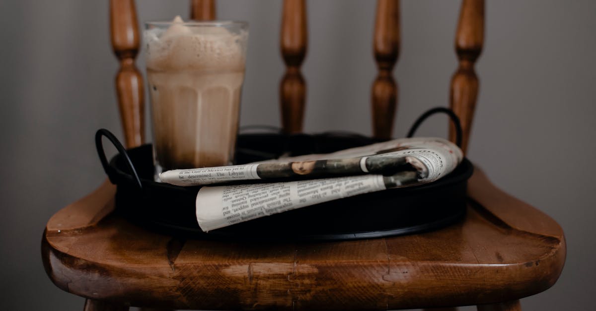 Is there any botulism risk in homemade cold brew coffee? - Foamy coffee and newspaper served on tray placed on chair