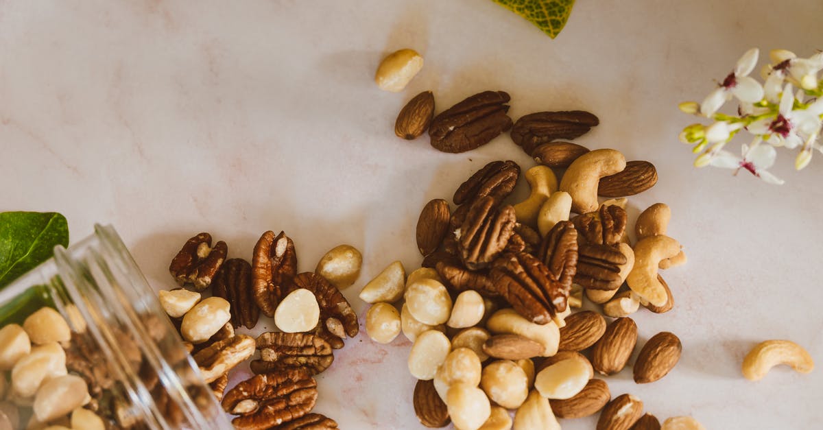 Is there any way to "Salt" unsalted cashew pieces? - Brown Almond Nuts on White Table