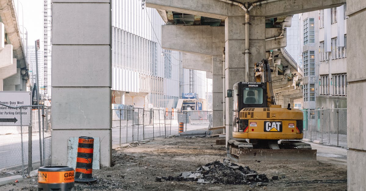 Is there any way to sous-vide without a machine - Site of roadway under concrete bridge construction with heavy equipment on dirty ground