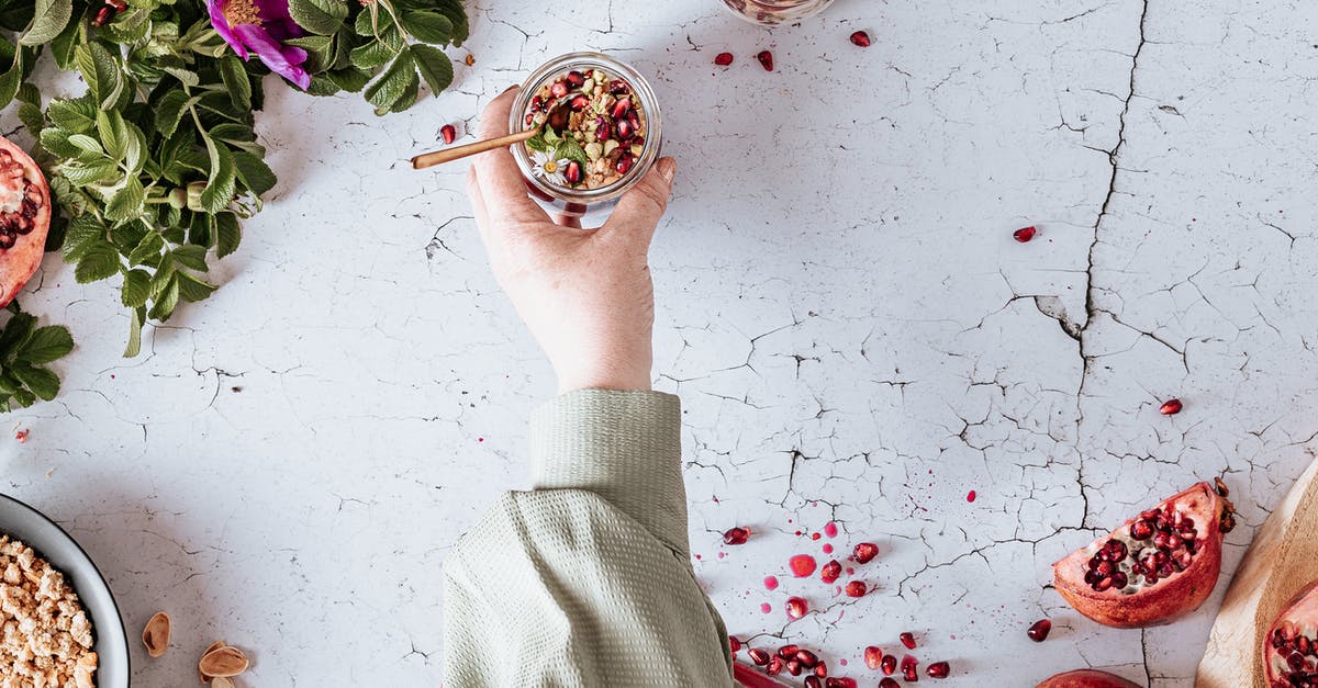 Is this Pomegranate Molasses rescuable? - Person Holding Green Plant on White Ceramic Bowl