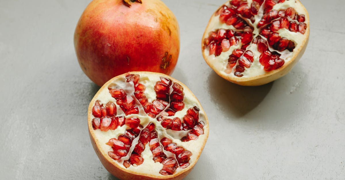 Is whole grain rye supposed to taste so coarse? - Ripe whole and halved pomegranates with red seeds placed on gray background in studio