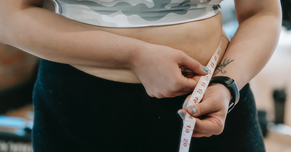 Isn't moisture a problem when measuring flour by weight? - Plump woman in sportswear with measuring tape