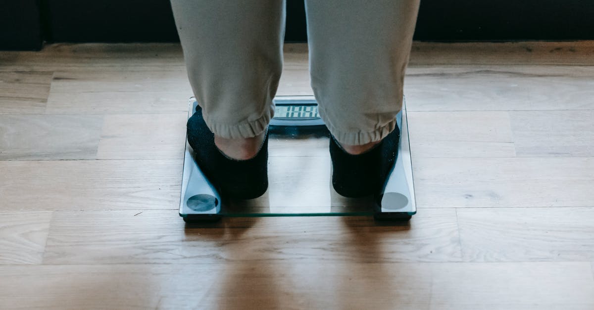 Isn't moisture a problem when measuring flour by weight? - Plus size woman standing on scale