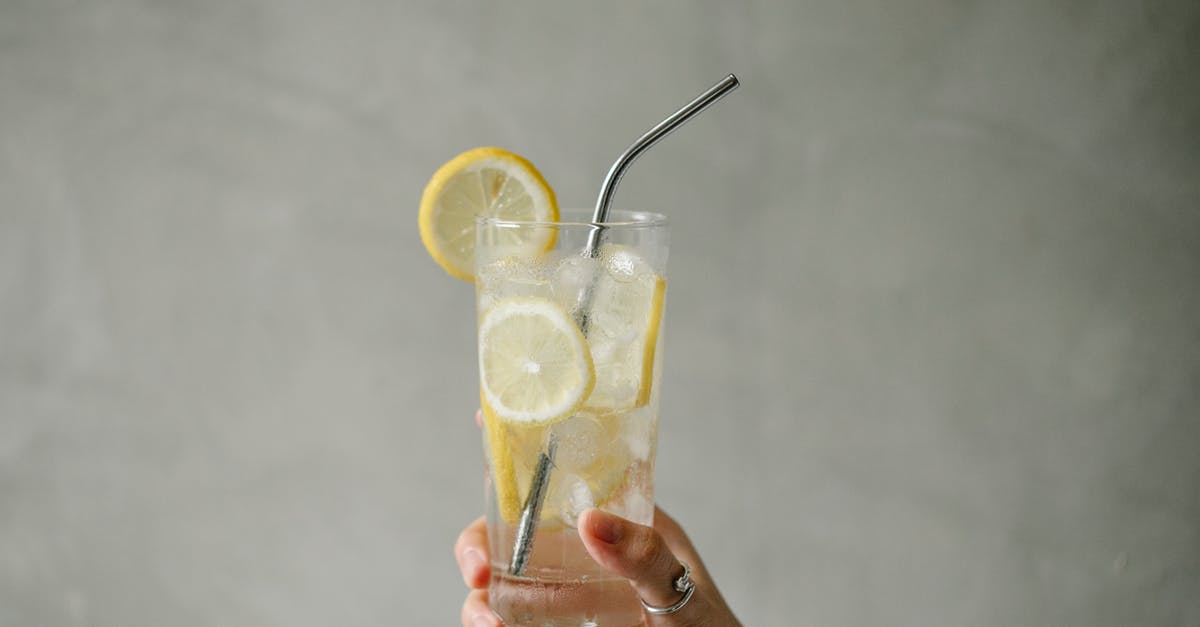 Items in freezer, including ice cubes, taste freezer burnt. Possible causes? - Crop woman with glass of lemonade