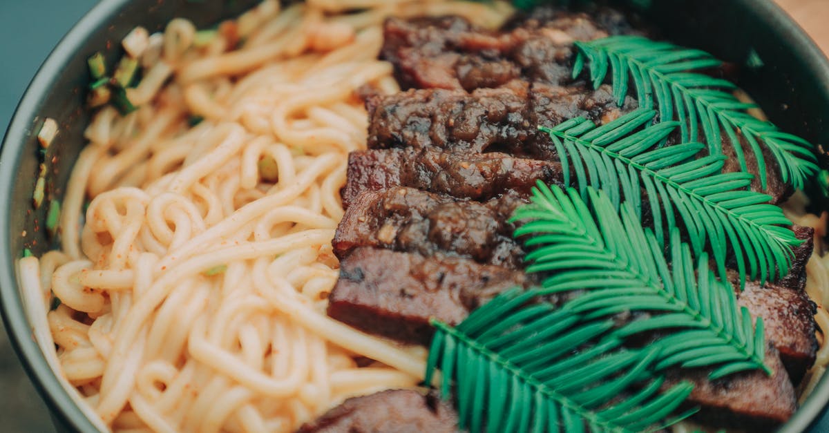 its harmful to eat not very well cooked beef? - Photo of Noodles With Meat and Garnish