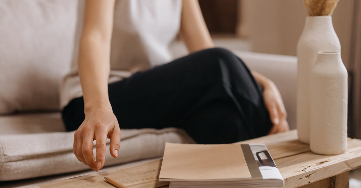 Jalapeno Poppers and getting a thick crust? - Woman in White Shirt and Black Pants Sitting on Chair Reading Book