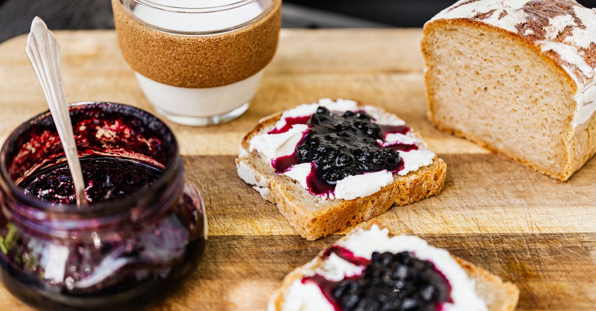 Jam and Marmalade setting - Brown Bread with Jam and White Cream on Brown Wooden Table