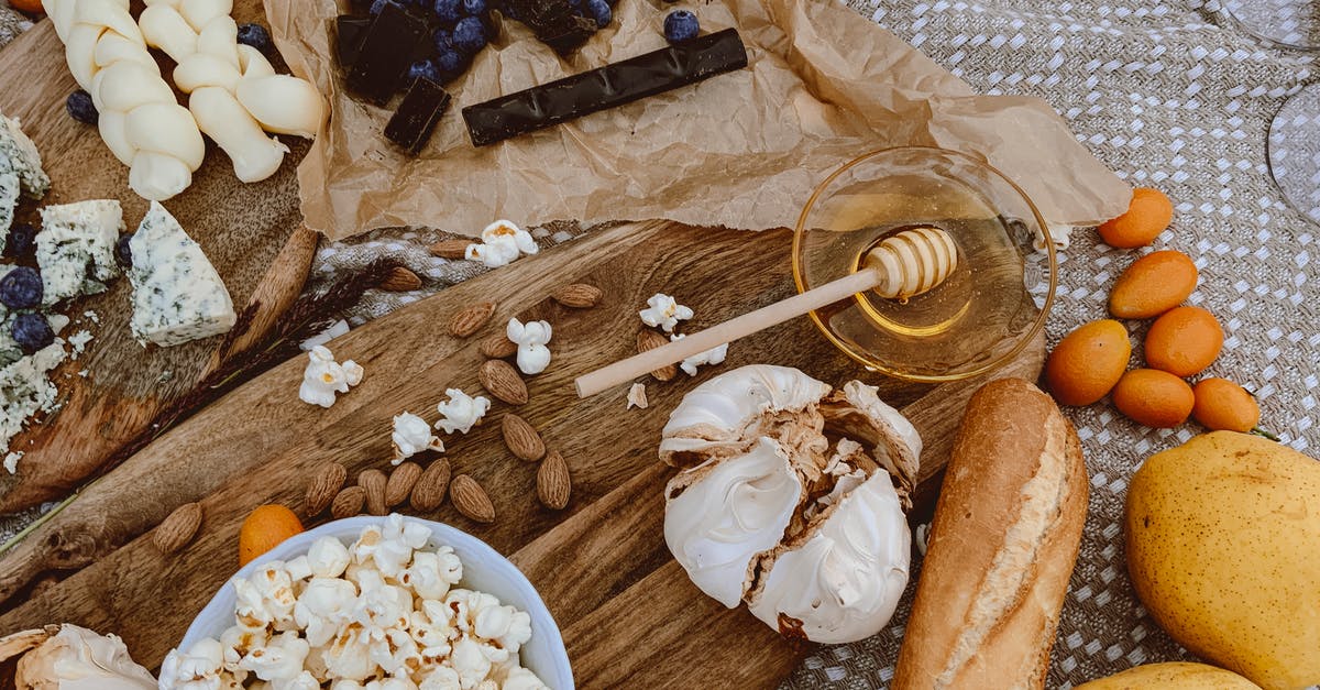 Jaw Shattering popcorn - Brown Wooden Chopping Board With White Cream and Brown Bread