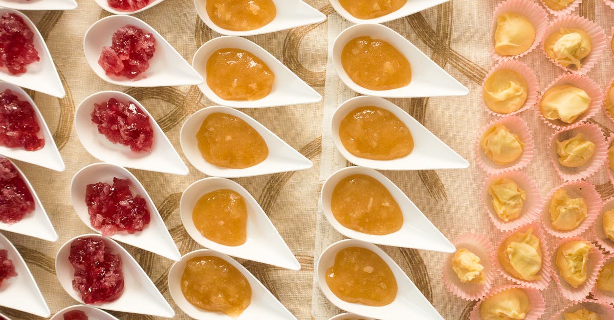 Jelly or flavored Gelatin - Red and Yellow Jam in White Ceramic Plates and Pastry