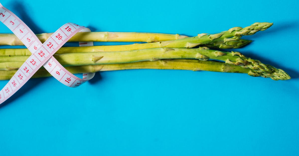 Jerk vegetable? - Brown Wooden Stick on Blue Surface